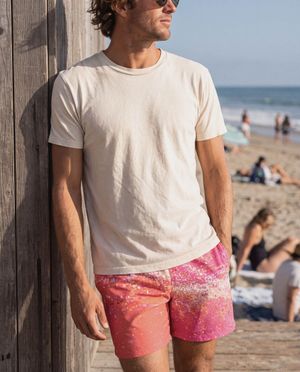 Coral to Hot Pink Pixelate men's swim trunks