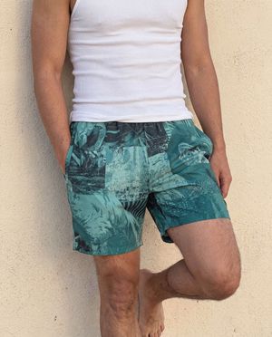 Transformative Teal Flamboyance men's swim trunks